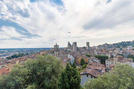 Bergamo, Italy - July 10, 2021: street view of Bergamo Alta citadel in full daylight, people are visible in the distance.のeditorial素材