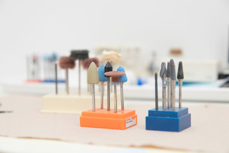 Close up detail of dentist work tools, no people are visible.