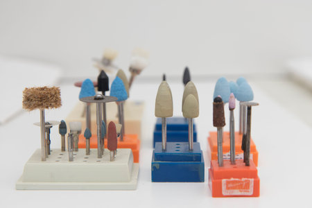 Close up detail of dentist work tools, no people are visible.