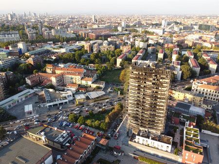 Milan, Italy - September 2, 2021: street view of the burned skyscraper Torre dei Moro in Milan,...