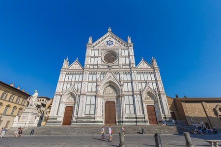 Firenze, Italy - August 16, 2021: street view of Piazza Santa Croce in Florence, people are visible in the far distance under a blue sky.のeditorial素材
