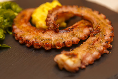 Close up on spanish food tapas on a restaurant table top, no people are visible.