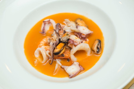 Close up on an italian gourmet seafood recipe, served on a restaurant table.