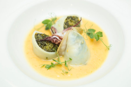 Close up on an italian gourmet seafood recipe, served on a restaurant table.