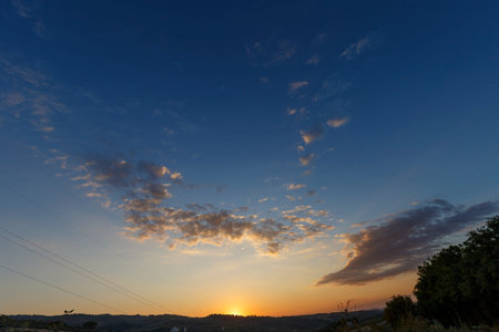 Sunset in Tuscany, Italy. Beautiful sky with clouds