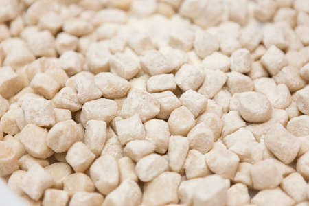 Pile of uncooked gnocchi pasta close-up.の写真素材