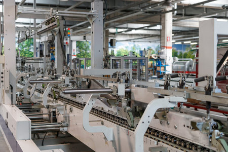 Industrial machinery at work inside a facilityの写真素材