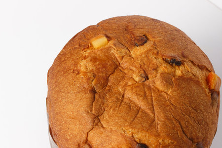 Close up on italian Christmas cake panettone, isolated on white.