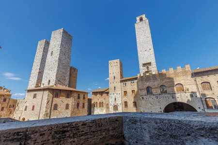 San Gimignano, Italy - August 19, 2021: panoramic view shot in a bright and sunny day in San Gimignano, Tuscany. No people are visible.のeditorial素材