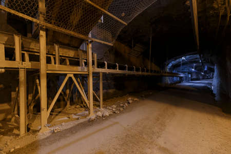 Inside a dark quarry mining plant, no people are visible.の写真素材