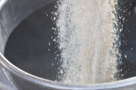 Close up on beer brewery tools inside a brewing facility, no people are visible.の写真素材