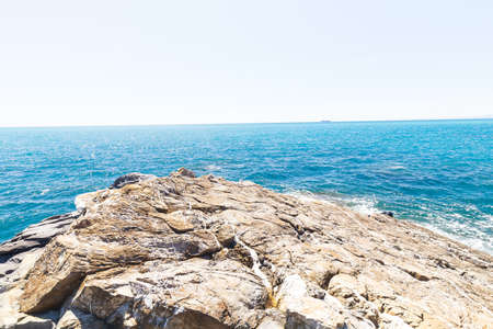 Nervi, Italy - April 10, 2022: seaside landscape on the Passeggiata di Nervi, Genova, during a sunny day.の写真素材