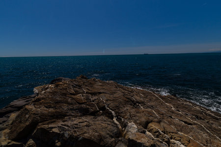 Nervi, Italy - April 10, 2022: seaside landscape on the Passeggiata di Nervi, Genova, during a sunny day.の写真素材
