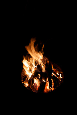 Burning bonfire on black background. Fire flames isolated on black background.