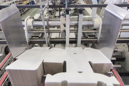 Production line of the plastic bottle on the conveyor belt in the factory. Industrial background