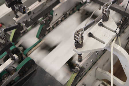 Close up view of the mechanism of a printing machine. Printing industry
