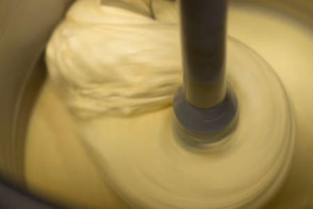 A closeup shot of the dough being kneaded in a mixerの写真素材