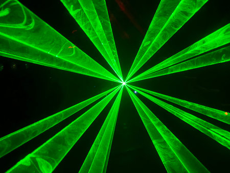 Colorful laser light beam photographic effect on black background. Nobody is visible.