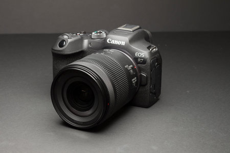 Milan, Italy - August 13, 2022: close up on Canon EOS R7 mirrorless camera in a studio environment....