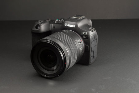 Milan, Italy - August 13, 2022: close up on Canon EOS R7 mirrorless camera in a studio environment....
