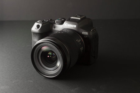 Milan, Italy - August 13, 2022: close up on Canon EOS R7 mirrorless camera in a studio environment....