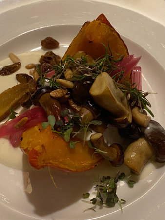 Mushroom salad on a white plate with spicesの写真素材