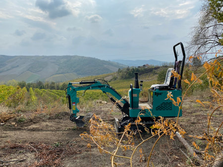 Excavator working on vineyardsの写真素材