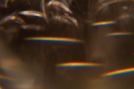 Colorful light leak on black background, abstract design with optical lens flare shot on a long...