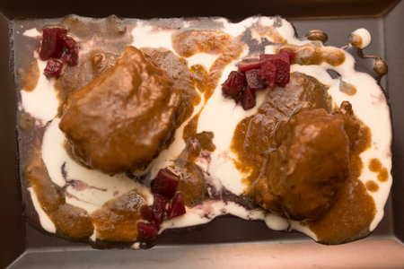 chocolate pudding with cranberries and cream, closeup of photoの写真素材