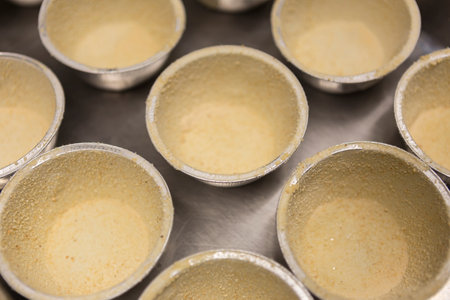 Close-up of baking tray filled with muffins in a bakeryの写真素材