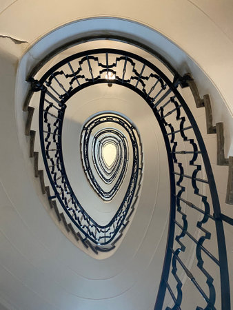 Spiral staircase in a white building, closeup of photoの写真素材