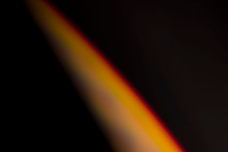 analogic light leak produced with glass crystal and led lights, background is pure black. Perfect for overlays.の写真素材