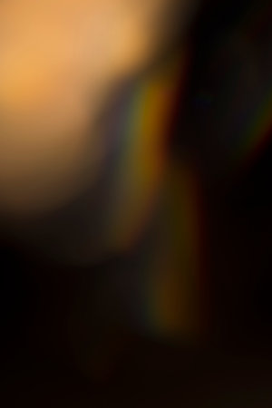 analogic light leak produced with glass crystal and led lights, background is pure black. Perfect for overlays.の写真素材