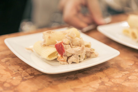 Tuna pasta on white plate in restaurant. Selective focus.の写真素材