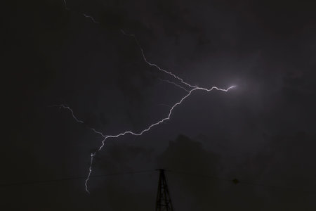Lightning in a cloudy sky, no people are visible.