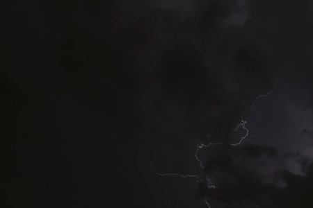 Lightning in a cloudy sky, no people are visible.の写真素材