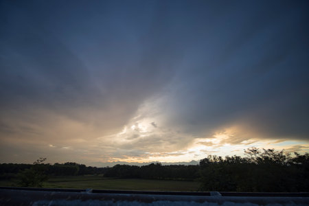 Dramatic sunset over the dam in the countryside of Thailand.の写真素材