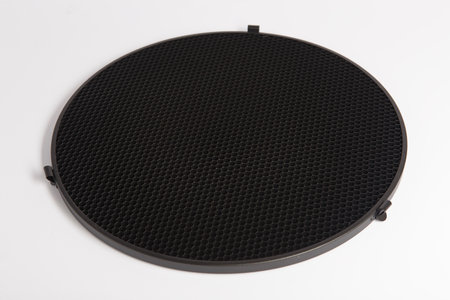 Black perforated object isolated on white background. Close up.の写真素材
