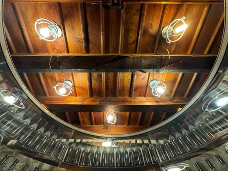 Ceiling of the old wooden house with incandescent lampsの写真素材