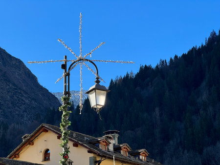 Vintage street lamp in the Dolomites mountains, Italy.