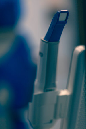 Close up on dentist tools, background is blurred and depth of field is shallow.