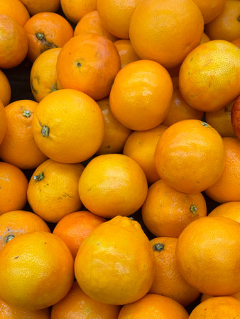 Oranges in the market, close-up, background and textureの写真素材