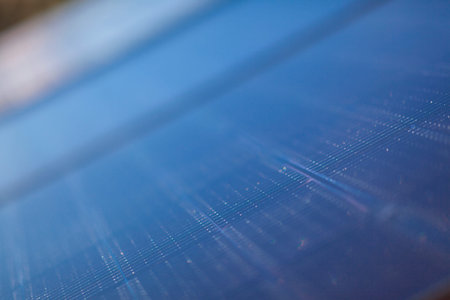Installing PV photovoltaic  solar panels on the roof. No people are visible, close up image in...