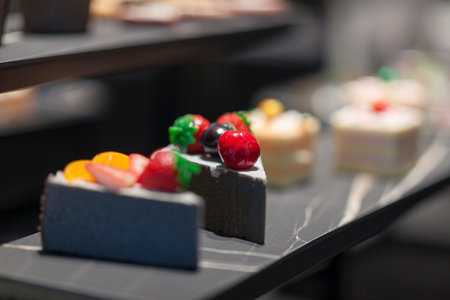 Different types of cakes in a shop window. Close-up.の写真素材