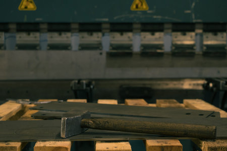 Detail of heavy industry manufacturing, sparks come out of a metal working welder.の写真素材