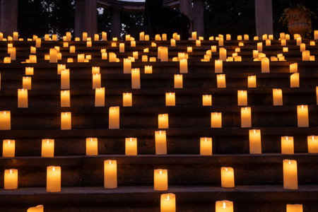 Milan, Italy - July 3, 2024: gardens of Villa Clerici decorated with candles in twilight.の写真素材