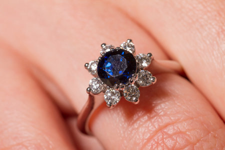 Macro shot of a jewel ring on a female hand.の写真素材