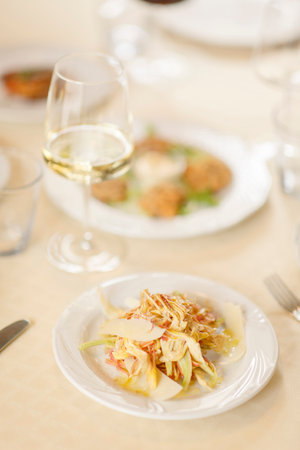 Close up on italian traditional northern food on a restaurant table.の写真素材