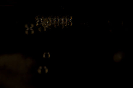 Macro shot of Champagne sparkling in a wine glass, background is blurred.の写真素材