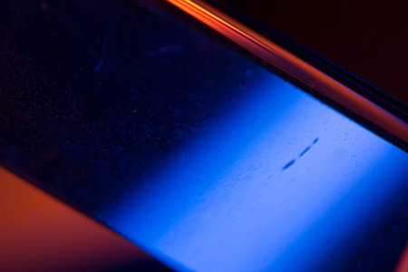 Colorful light leak on black background, abstract with optical lens flare shot on a true photo lens.